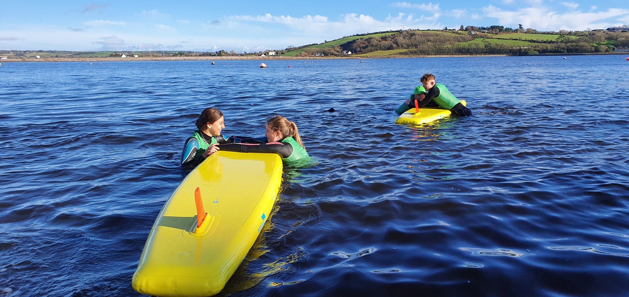 lifeguard training at beach with inflatable prone rescue boards from red rescue