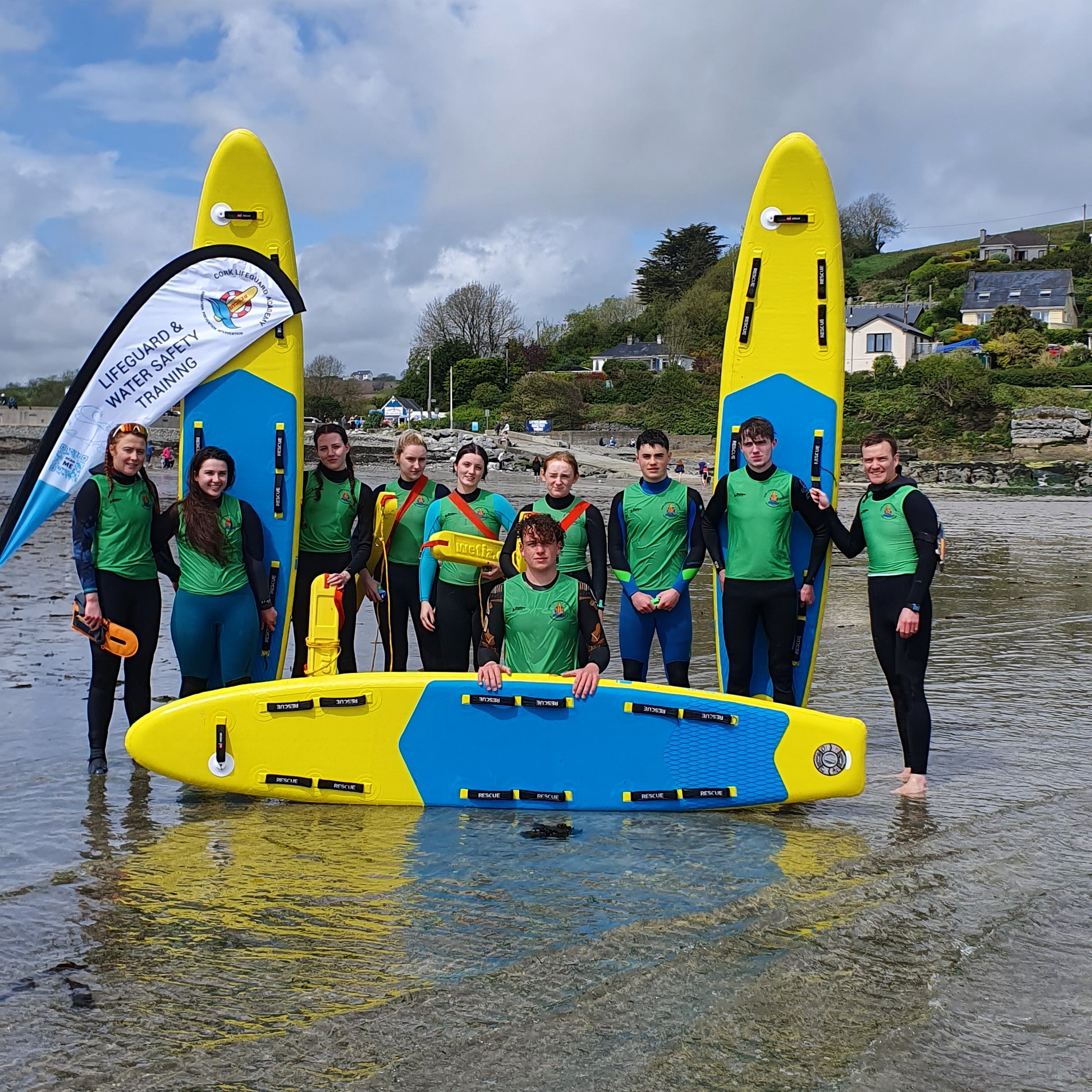 lifeguard training at beach with inflatable prone rescue boards from red rescue