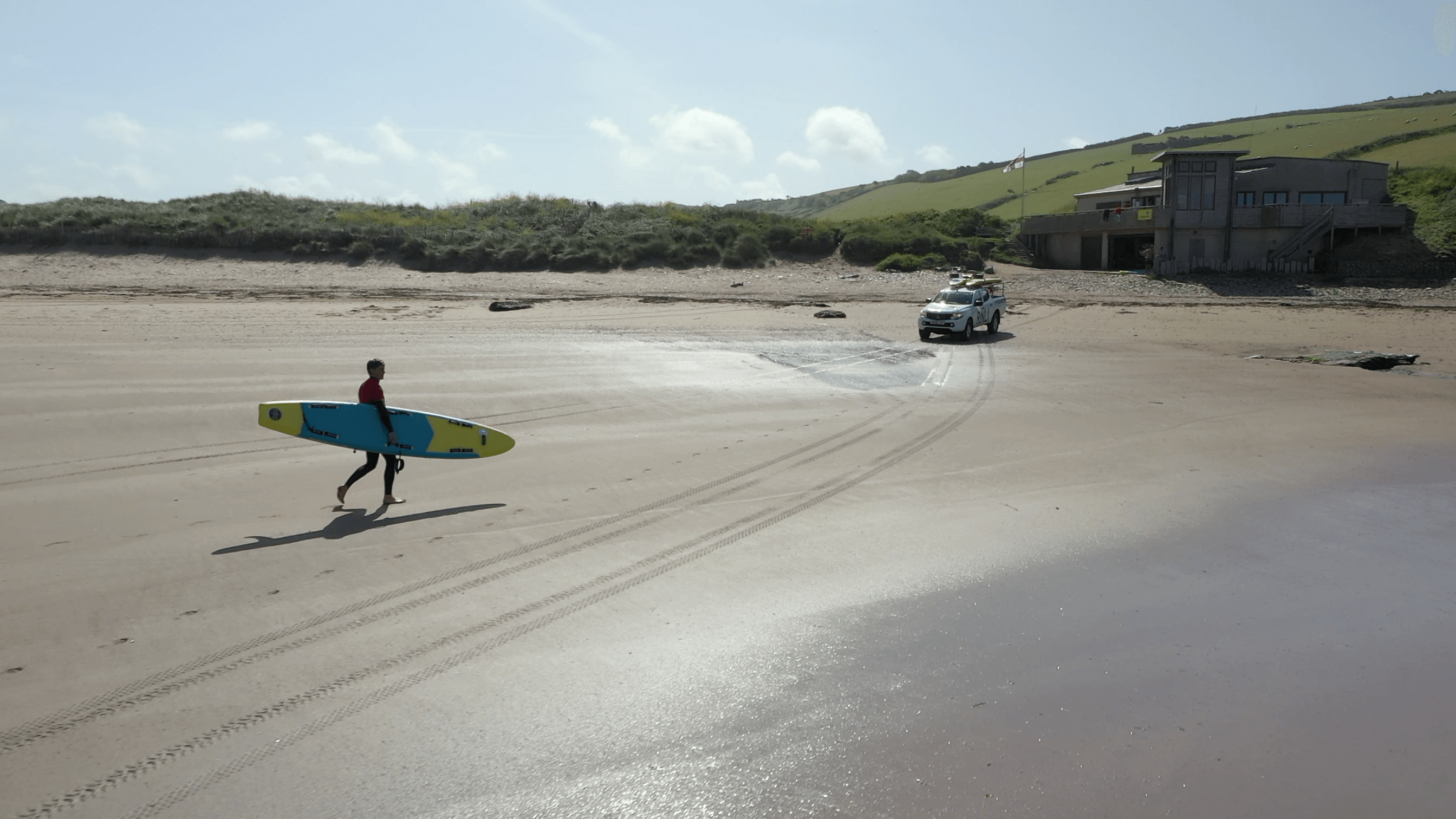 beach rescue ;lifeguard with inflatable prone rescue board