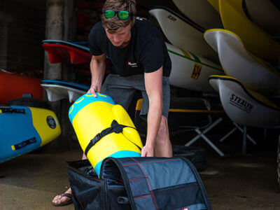 Unpacking inflatable rescue board at surf lifesaving club