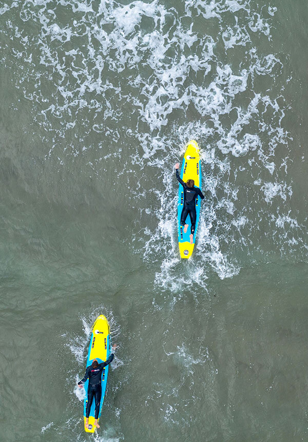 Surf lifesaving rescue boards being paddled